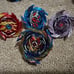 Beyblades; launchers; arenas