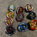 Beyblades; launchers; arenas