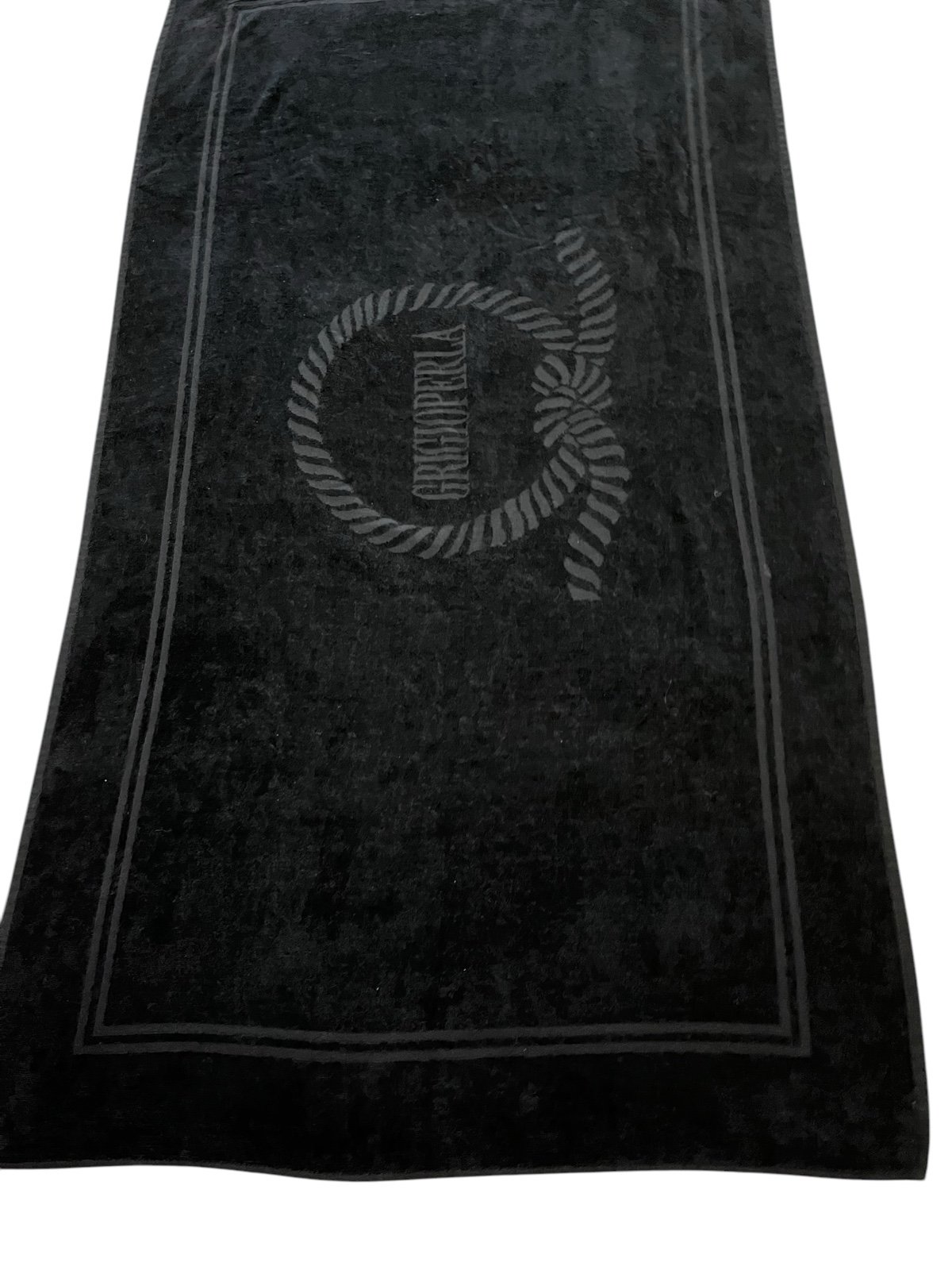 Grigioperla, an Italian brand. The towel has a textured border and features the