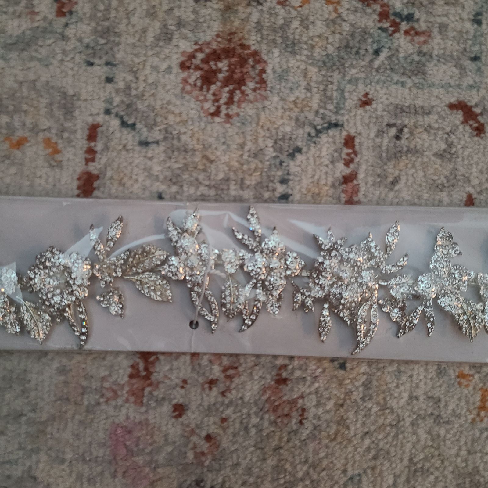 Vera Wang Silver Sash with simulated diamonds.