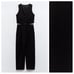 NWOT. Zara Black Darted Sleeveless V-neck Jumpsuit. Size XL.
