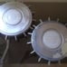 Two antique Volvo 240 hubcaps