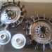 Two antique Volvo 240 hubcaps