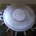 Two antique Volvo 240 hubcaps