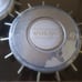 Two antique Volvo 240 hubcaps