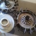 Two antique Volvo 240 hubcaps
