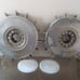 Two antique Volvo 240 hubcaps