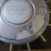 Two antique Volvo 240 hubcaps