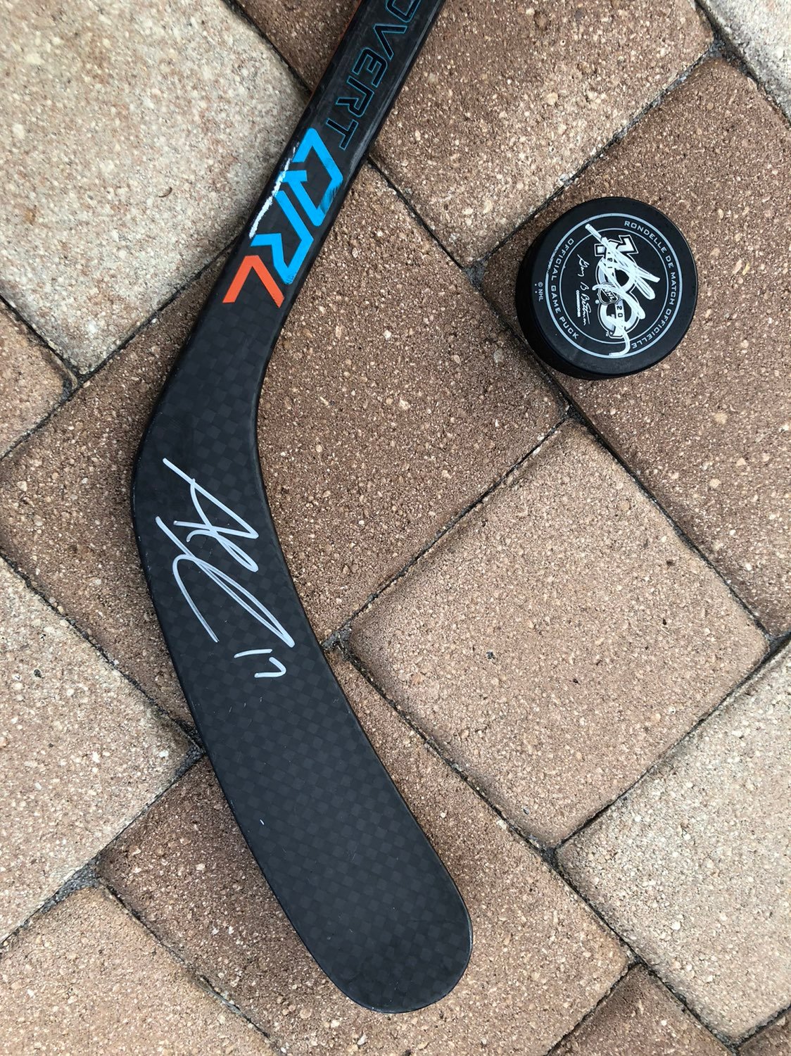Signed Alex Killorn game used puck and h