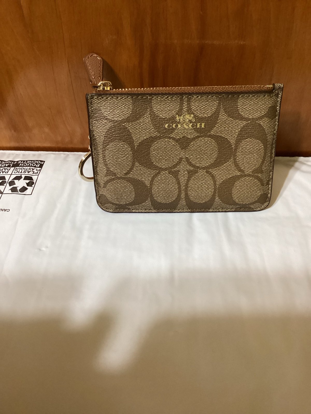 New with tags tan Coach Signature leather key pouch/wallet