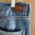 Distressed buckle jeans