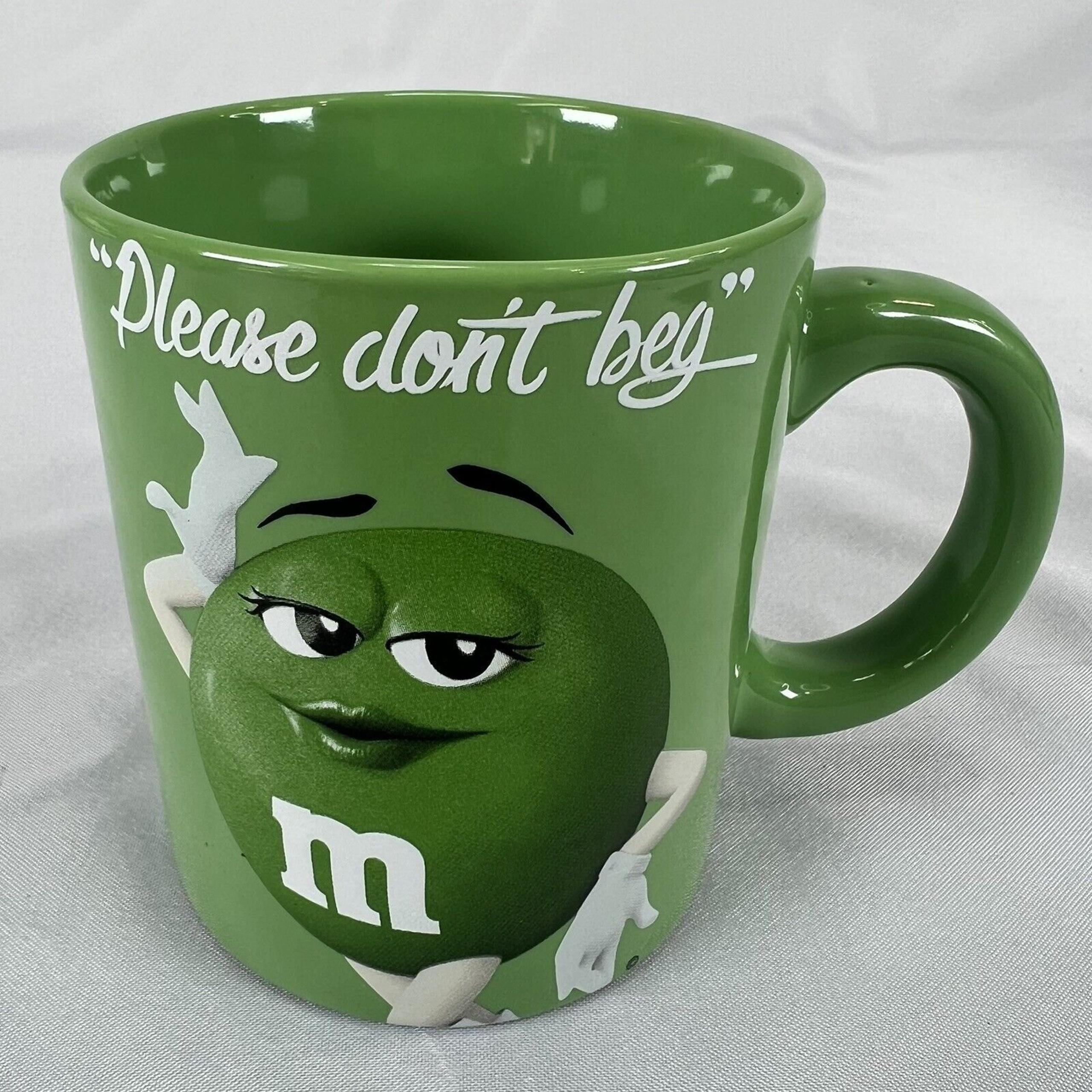 GREEN M&M COFFEE MUG "PLEASE DONT BEG"