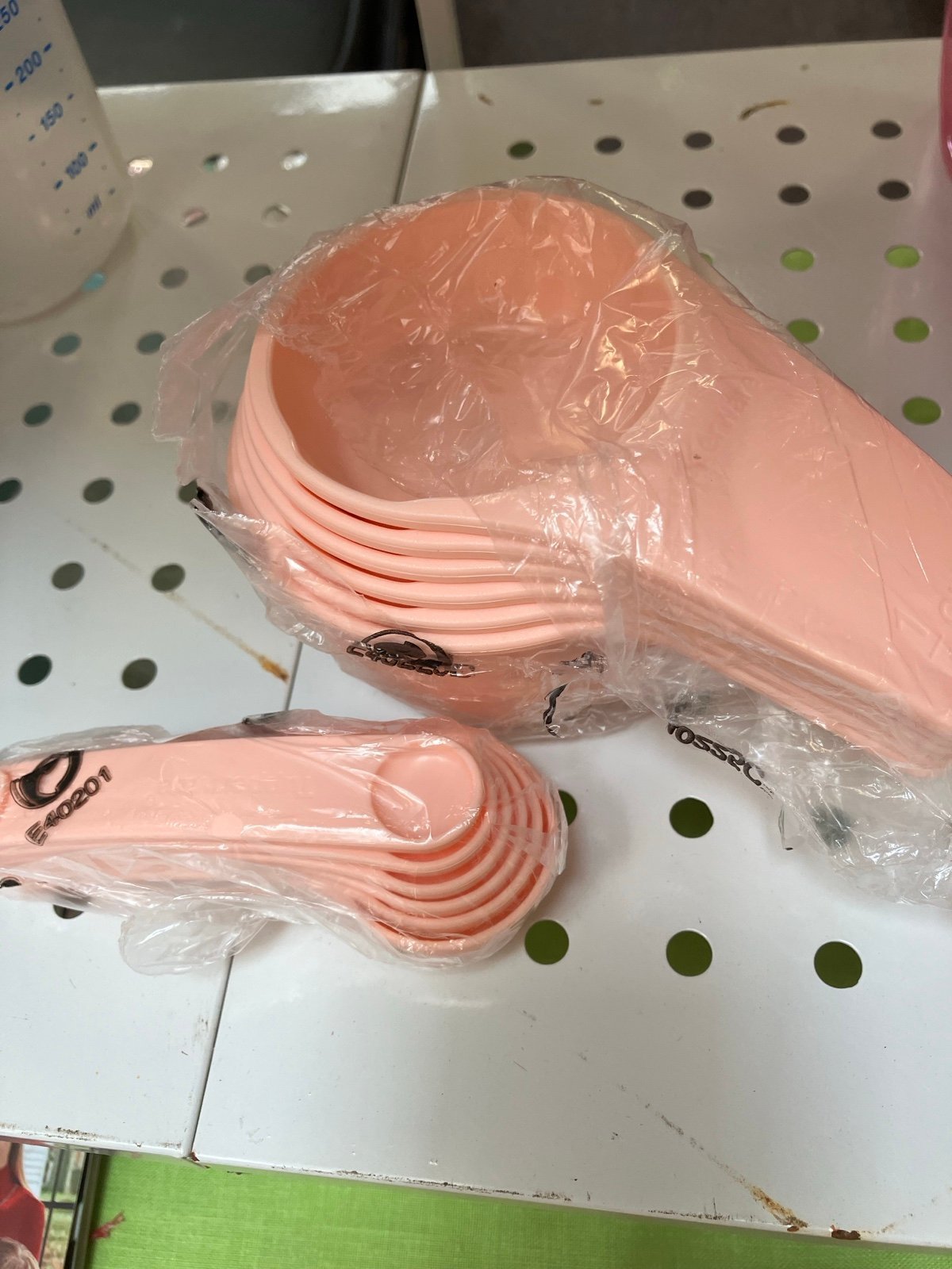 New Tupperware measuring cups and spoons peach color