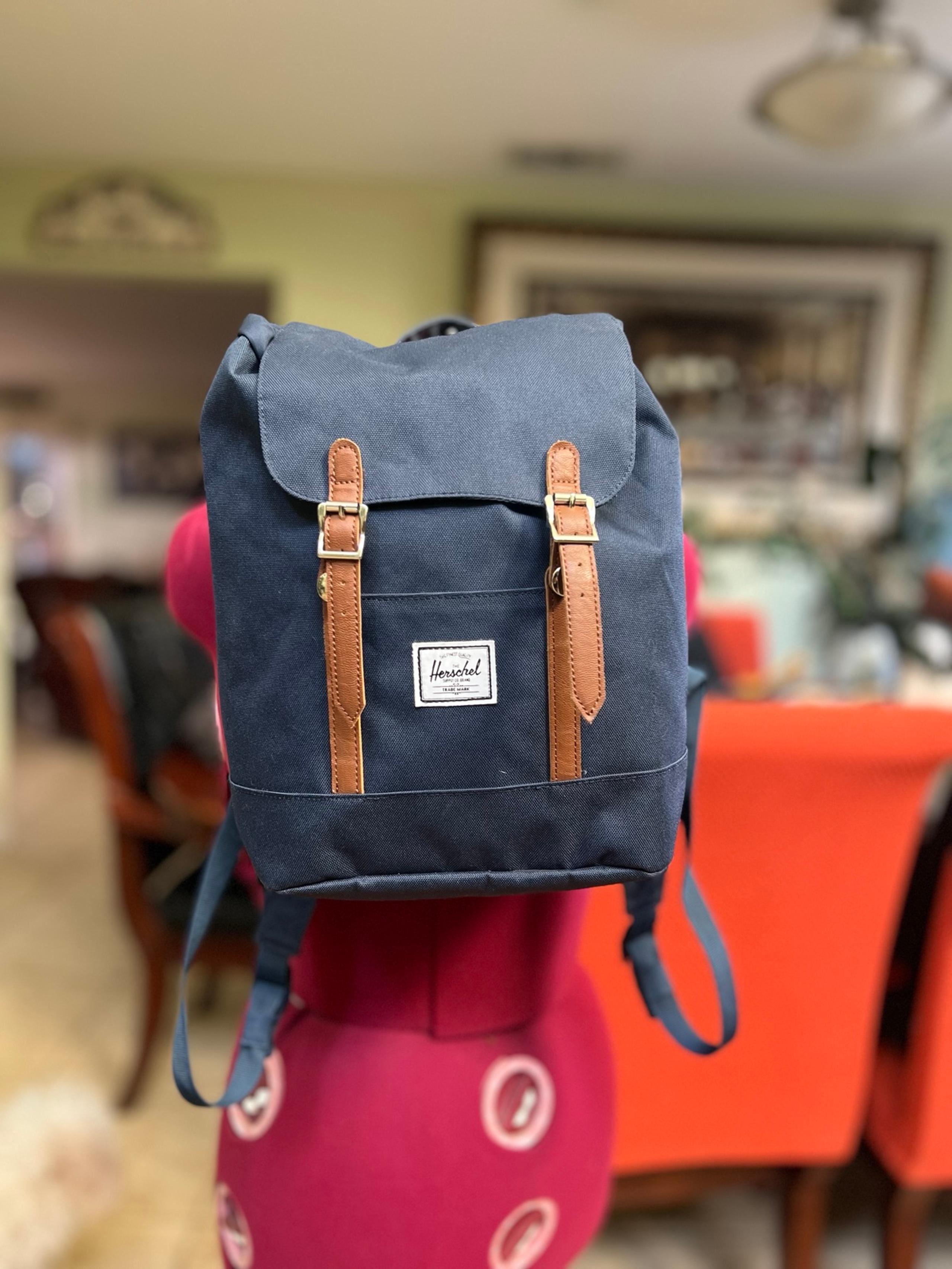 This is an original Herschel BackPack, navy blue, in like new condition.
