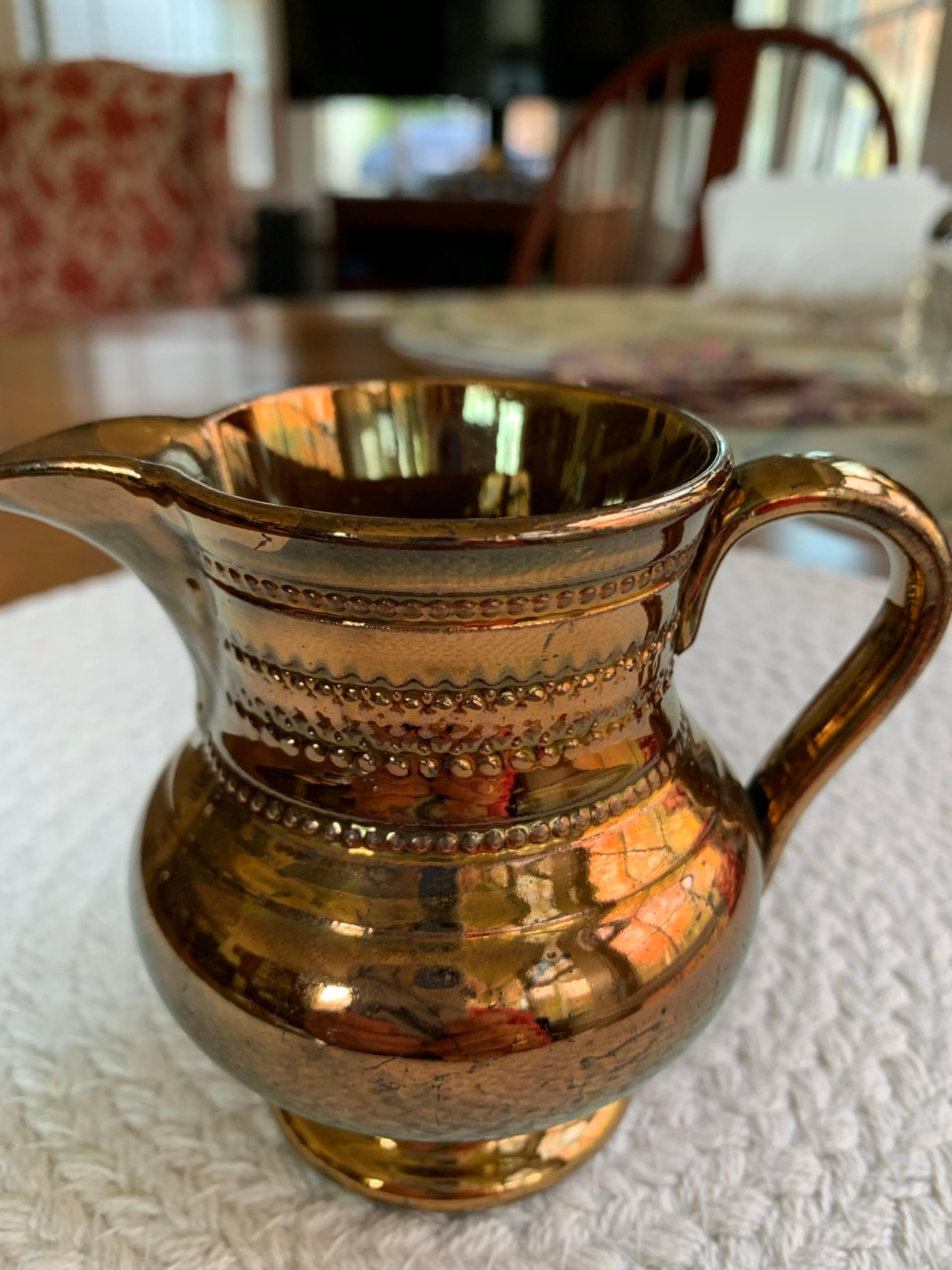 3 1/2 inch antique copper luster pitcher
