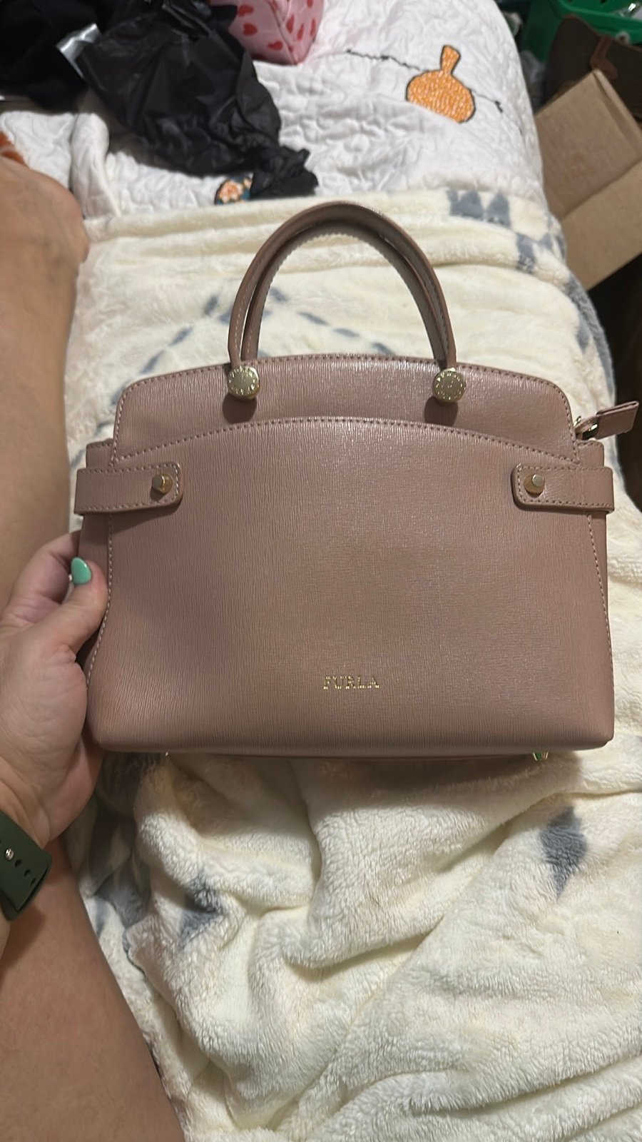 Furla light pink handbag.