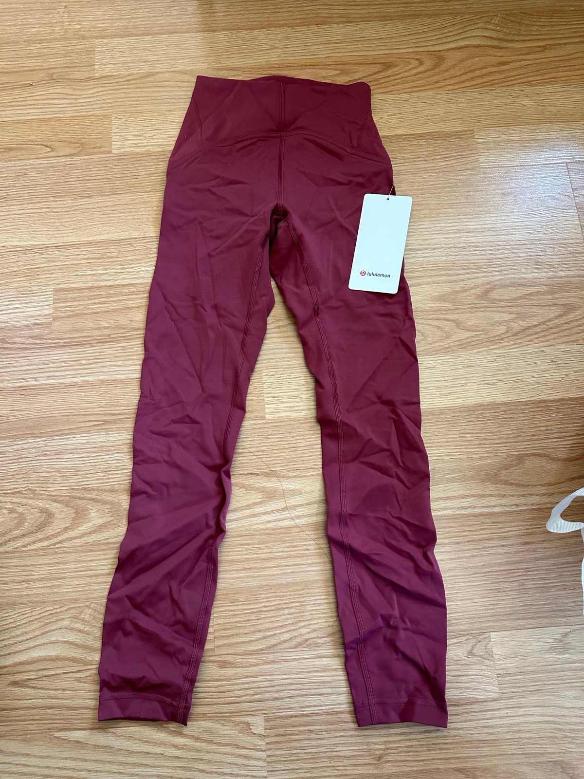 NWT Lululemon Instill HR Tight 25” in Mulled Wine and Size 2.