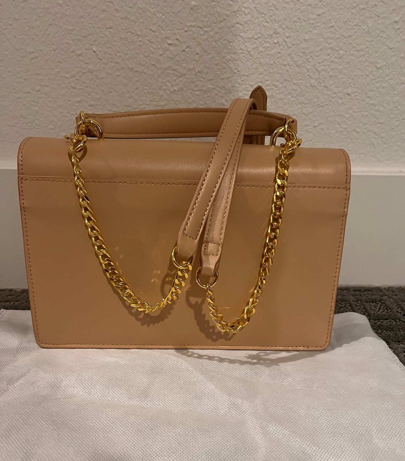 Beige bag with gold tone hardware