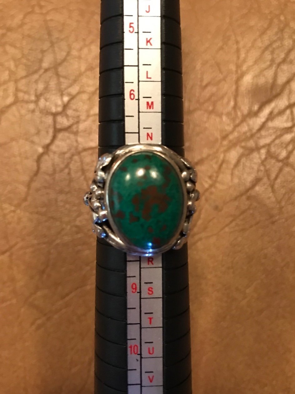 Sterling silver with beautiful greenish brown stone size 7.5, almost 8