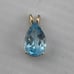 Vintage 4 carat pear shape, topaz pendant, 14 karat yellow gold