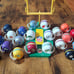 Lot of 26 Vintage 1973 NFL Mini Gumball Football Helmets with NFL Goal Post