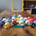 Lot of 26 Vintage 1973 NFL Mini Gumball Football Helmets with NFL Goal Post