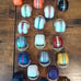 Lot of 26 Vintage 1973 NFL Mini Gumball Football Helmets with NFL Goal Post