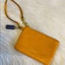 Orange Coach Wristlet