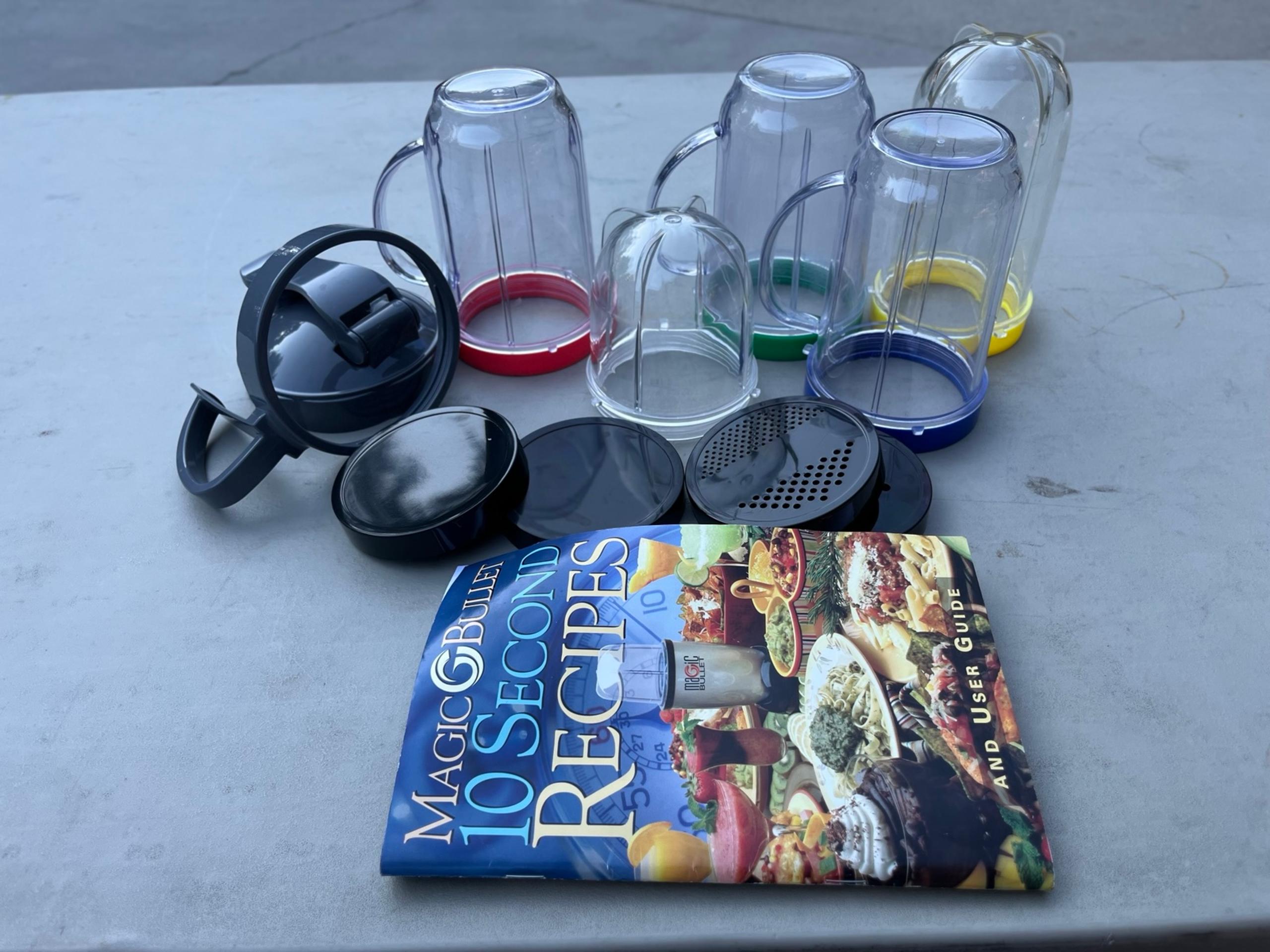 Magic Bullet parts and pieces with recipe book 16 pieces