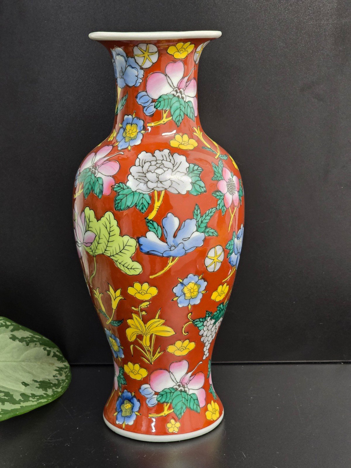 Chinese porcelain vase with a red-orange glaze and floral decoration stunning