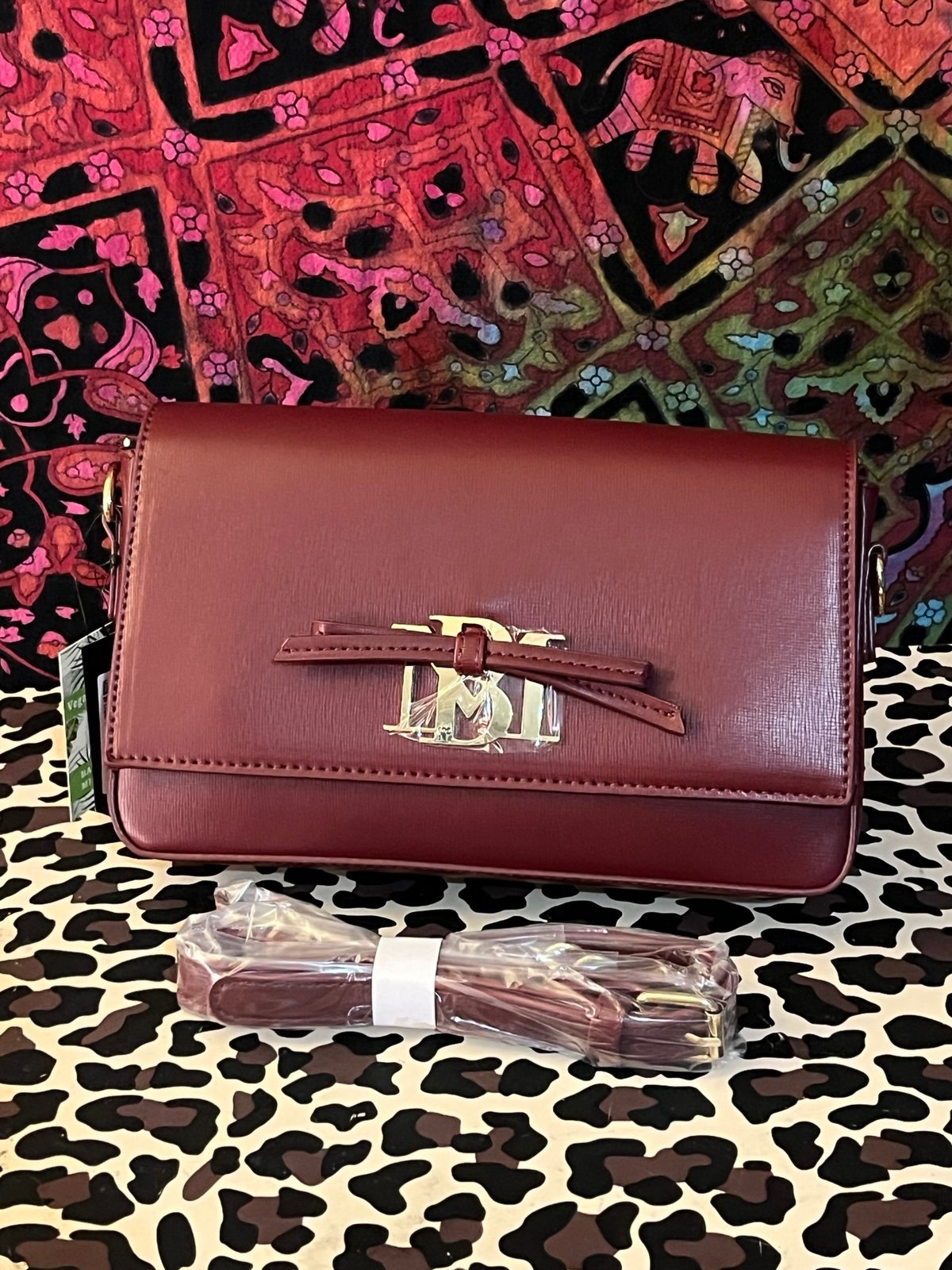 Badgley Mischka wine colored crossbody purse