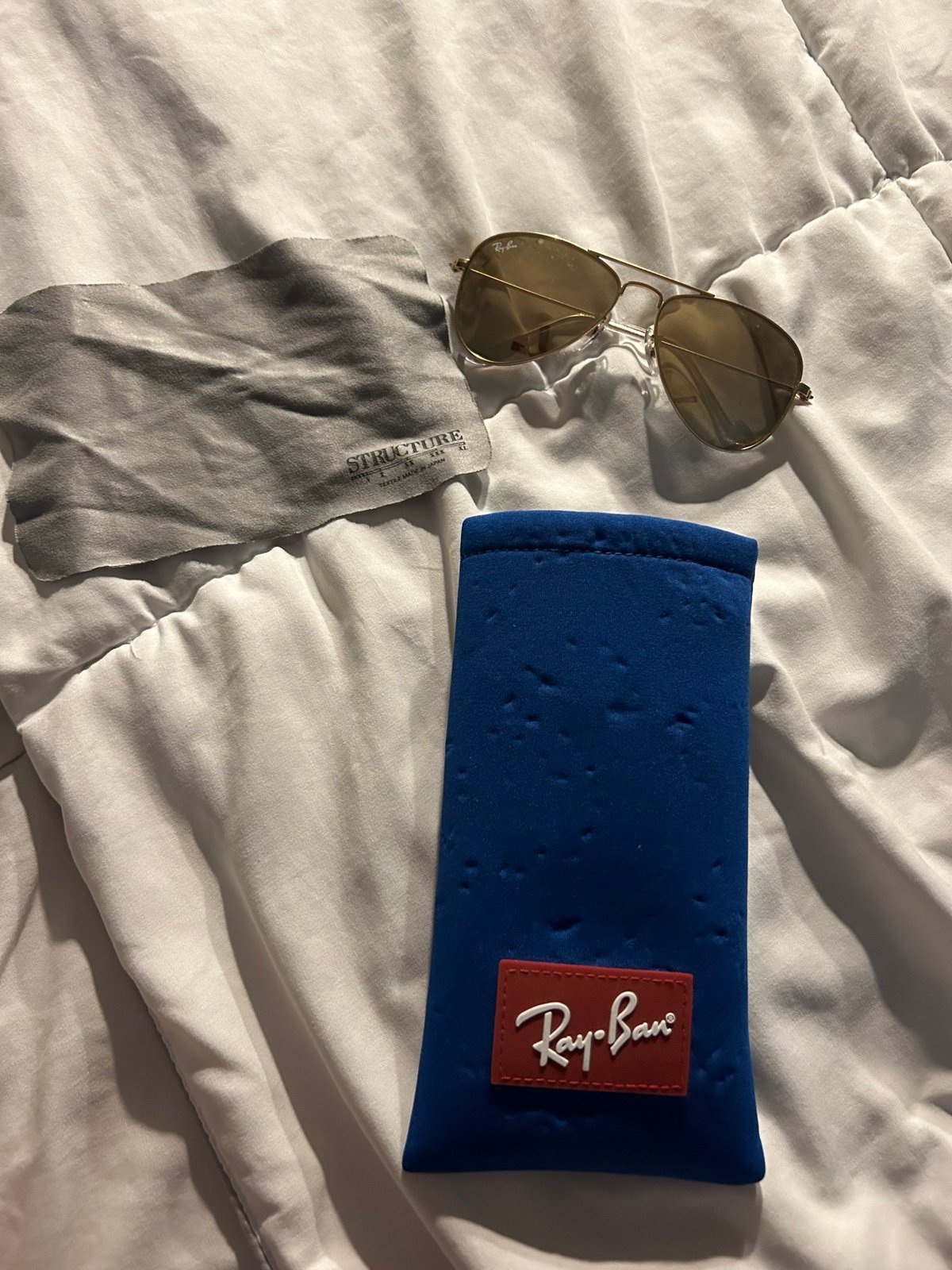 Golden raybans sunglasses