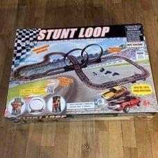 Two Slot car track with three new slot cars 7 cars total two tracks