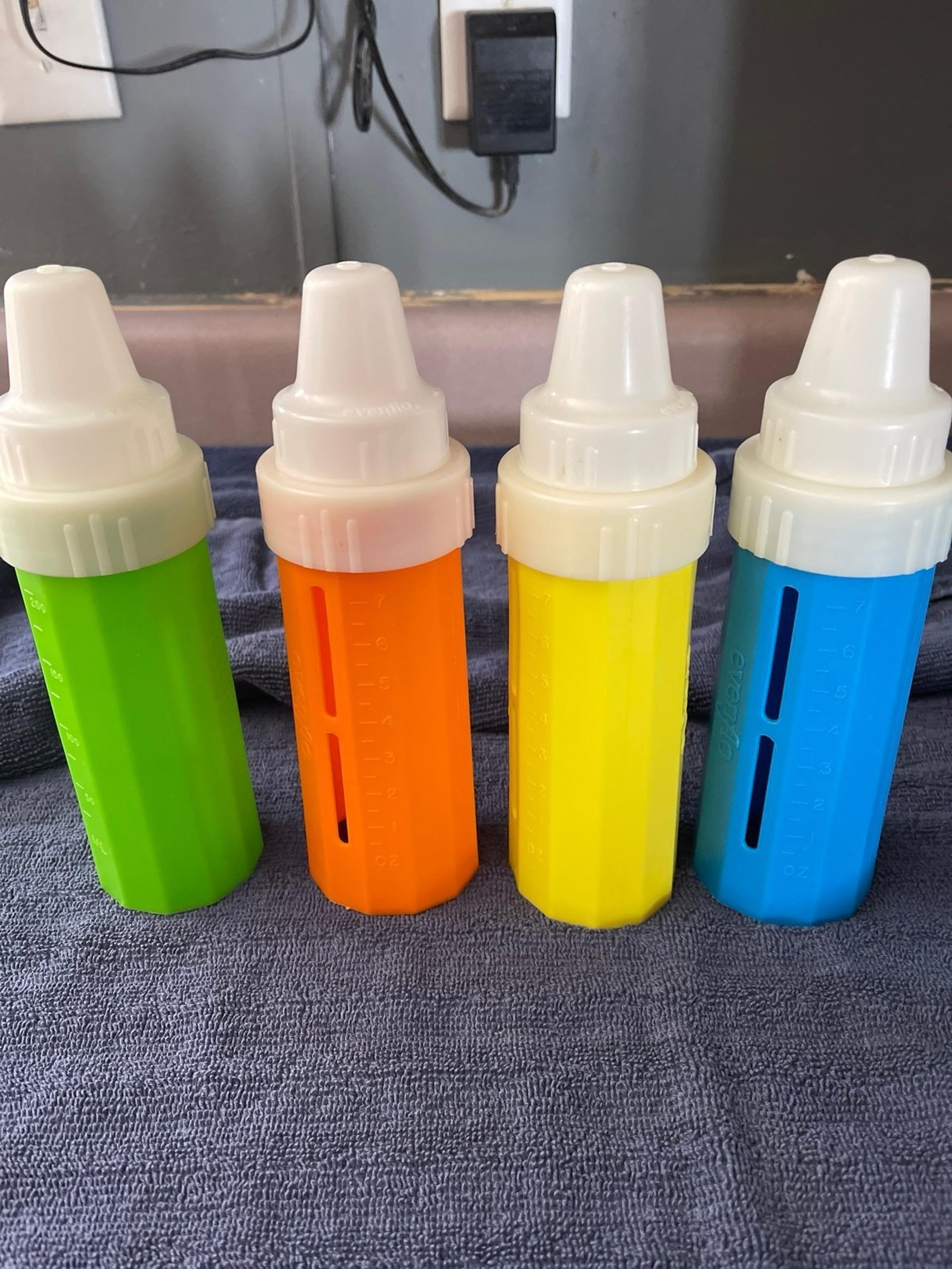 4 vintage evenflo bottles blue green yellow orange used liners