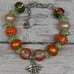 Orange Hand-Painted Glass Beads with Silver and Green Rhinestones and Bee Charm