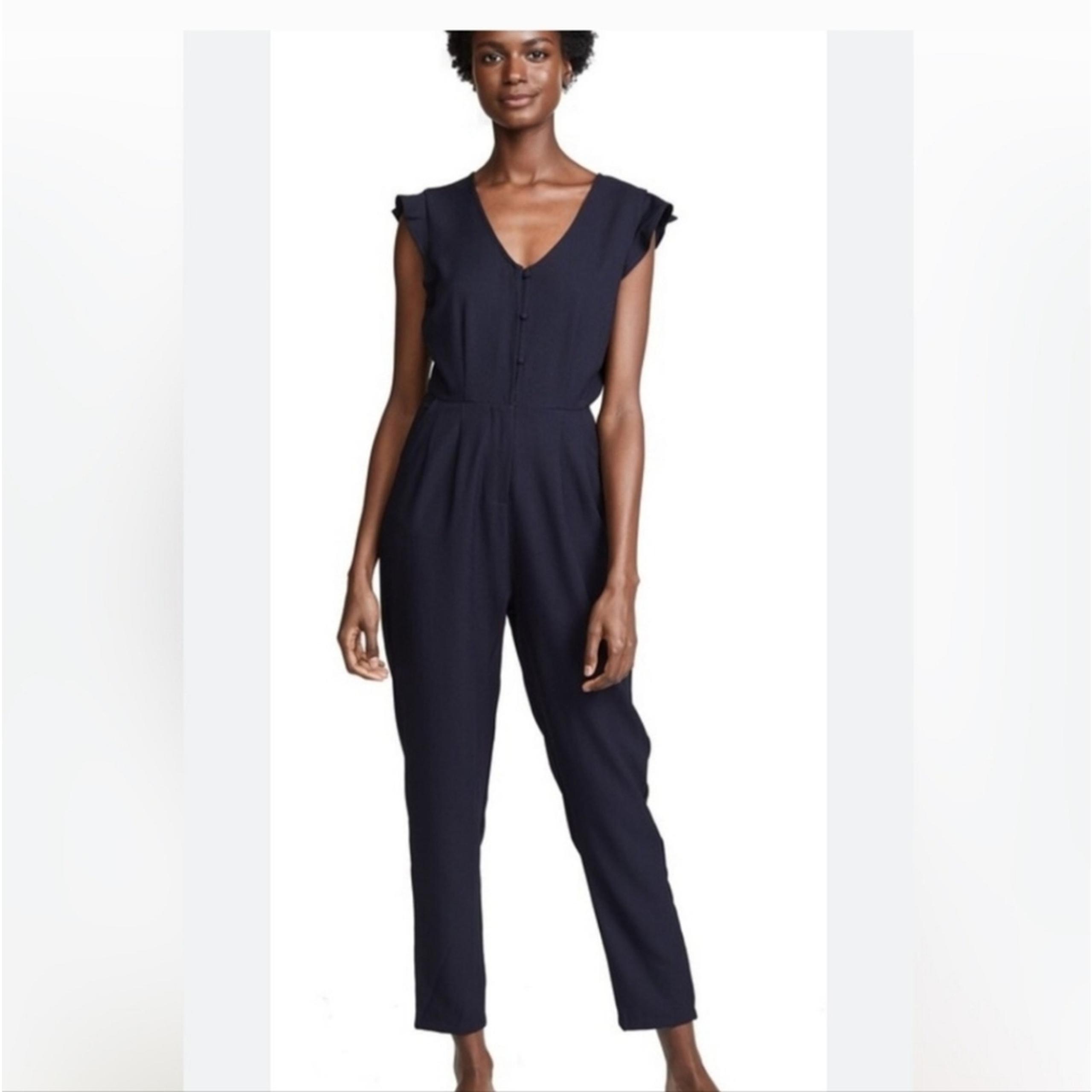 CUPCAKES & CASHMERE navy jumpsuit button front flutter sleeve tapered size 6