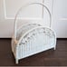 White wicker magazine rack basket