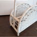 White wicker magazine rack basket