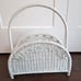 White wicker magazine rack basket