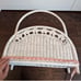 White wicker magazine rack basket