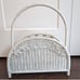 White wicker magazine rack basket