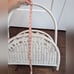 White wicker magazine rack basket