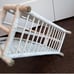 White wicker magazine rack basket