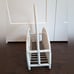White wicker magazine rack basket