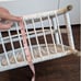 White wicker magazine rack basket