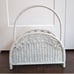 White wicker magazine rack basket