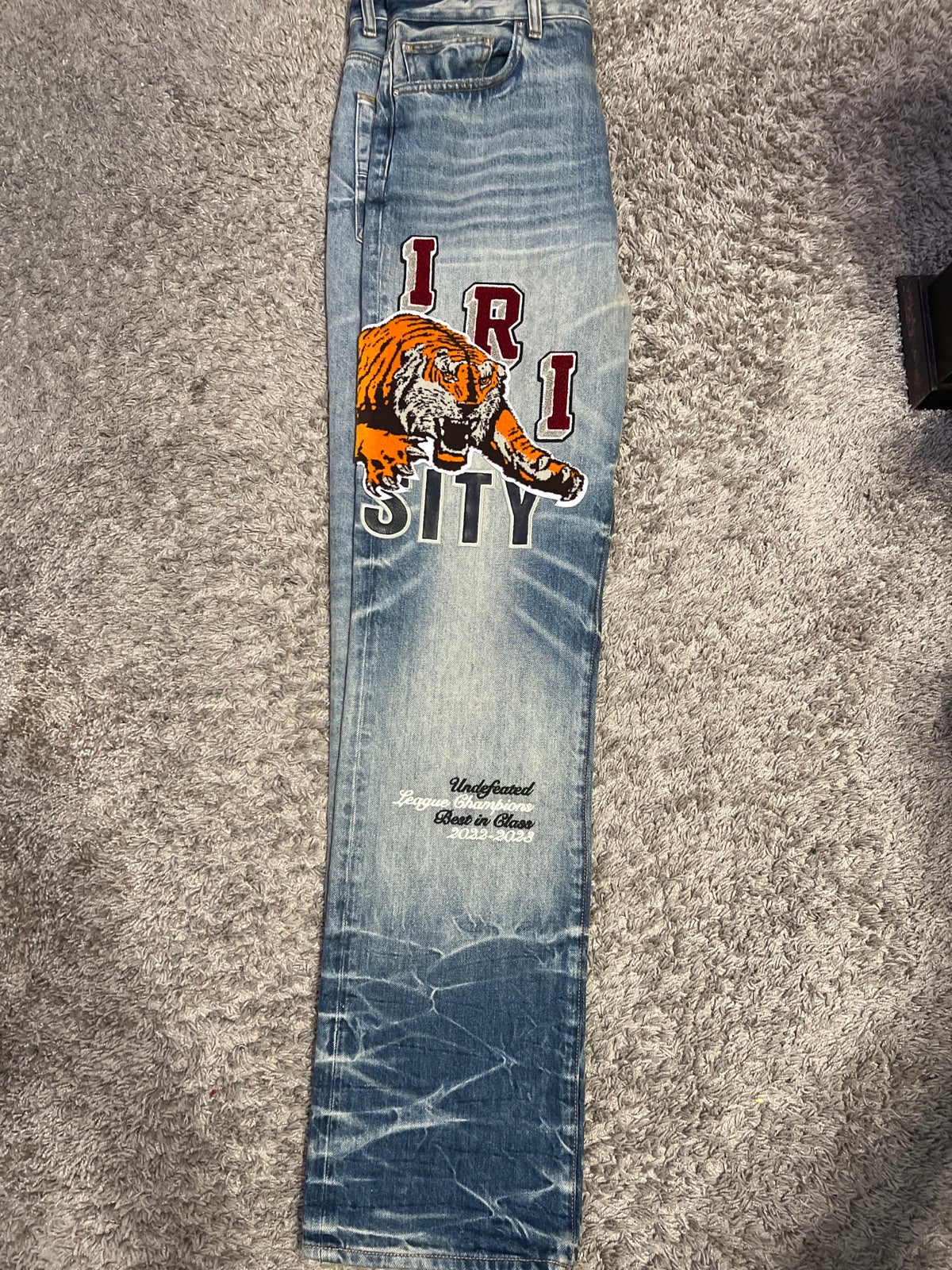 Amiri varsity tiger jeans