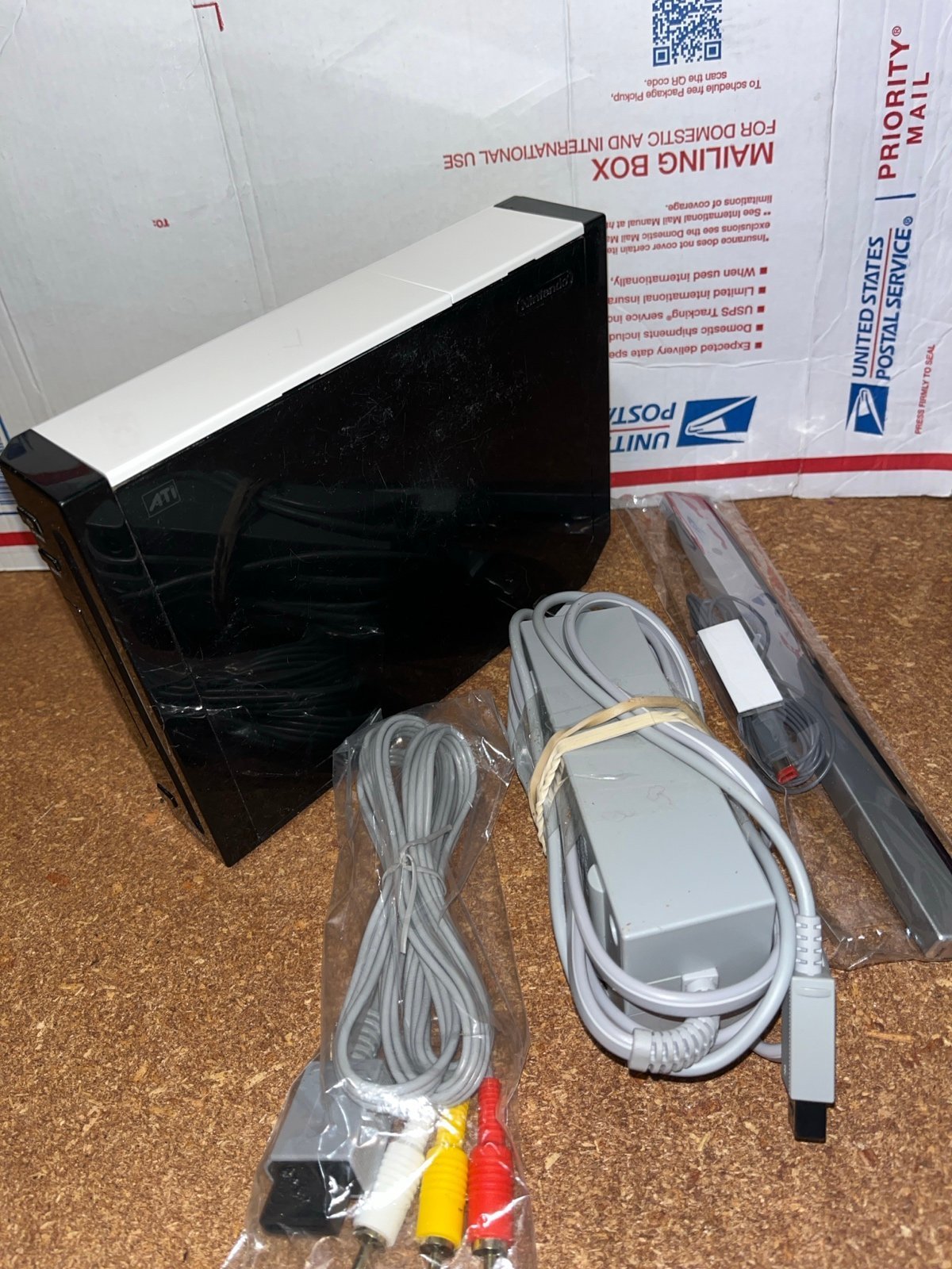 Black Nintendo Wii with Cords