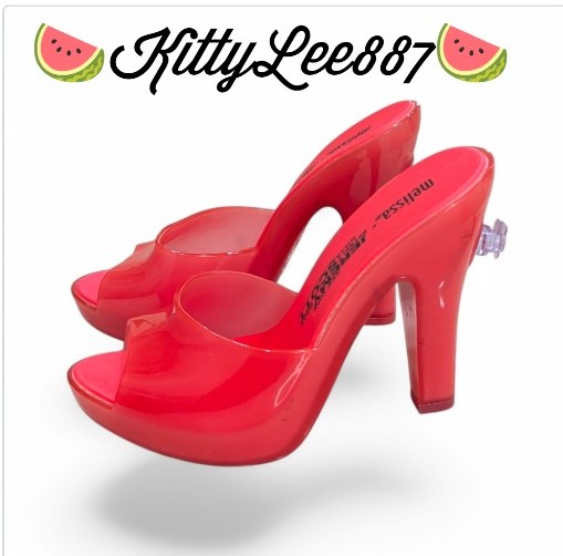 Melissa x Jeremy Scott Dark Pink color inflatable high heels.