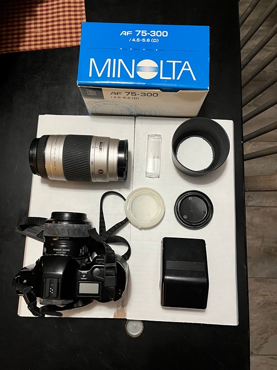 Minolta SPXL 35 mm camera and Minolta 75 300 zoom lens plus carrying case